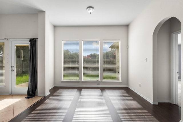 11047 Pierce Valley Dr, Richmond, TX 77406 - unfurnished dining area with arched walkways and tile patterned floors
