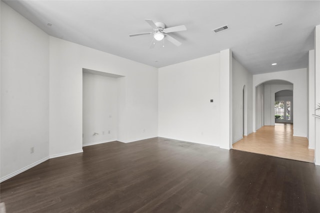 11047 Pierce Valley Dr, Richmond, TX 77406 - spare room featuring arched walkways, a ceiling fan, and wood finished floors