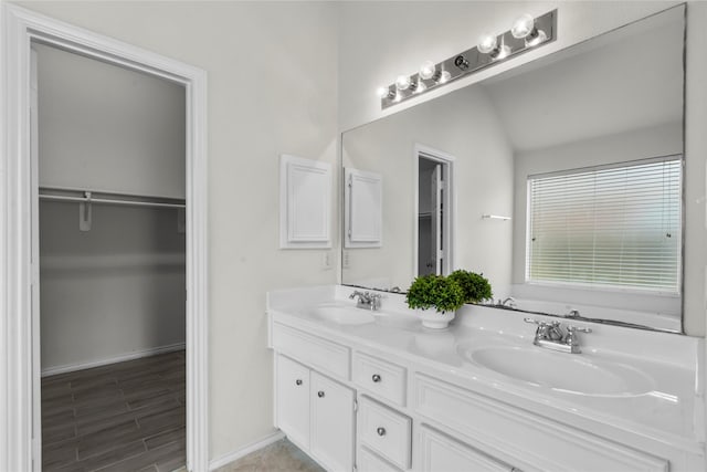 11047 Pierce Valley Dr, Richmond, TX 77406 - bathroom featuring double vanity and a spacious closet