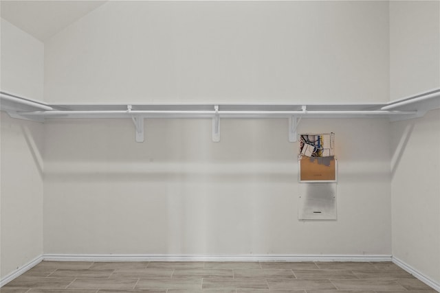 11047 Pierce Valley Dr, Richmond, TX 77406 - spacious closet featuring wood finish floors