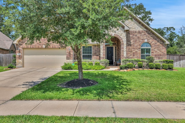 18774 Monetta Dr, New Caney, TX 77357 - view of front of property with brick siding, driveway, and an attached garage