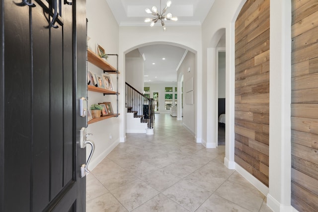 18774 Monetta Dr, New Caney, TX 77357 - entryway with arched walkways, ornamental molding, a chandelier, recessed lighting, and stairway