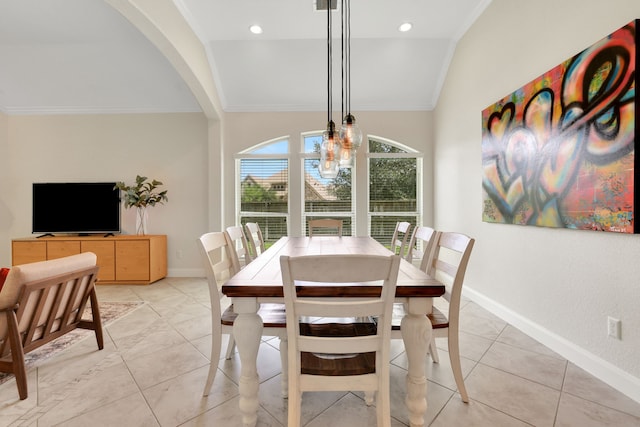 18774 Monetta Dr, New Caney, TX 77357 - dining room with crown molding, light tile patterned floors, arched walkways, lofted ceiling, and a chandelier