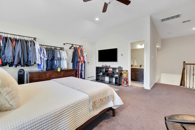 18774 Monetta Dr, New Caney, TX 77357 - carpeted bedroom with vaulted ceiling, ensuite bath, ceiling fan, and recessed lighting