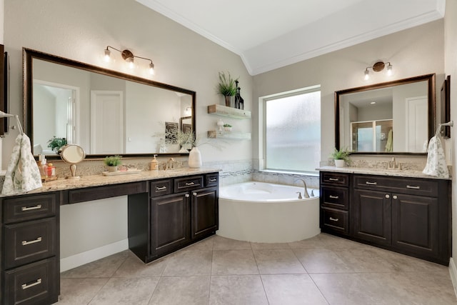 18774 Monetta Dr, New Caney, TX 77357 - bathroom with crown molding, two vanities, a bath, vaulted ceiling, and tile patterned floors