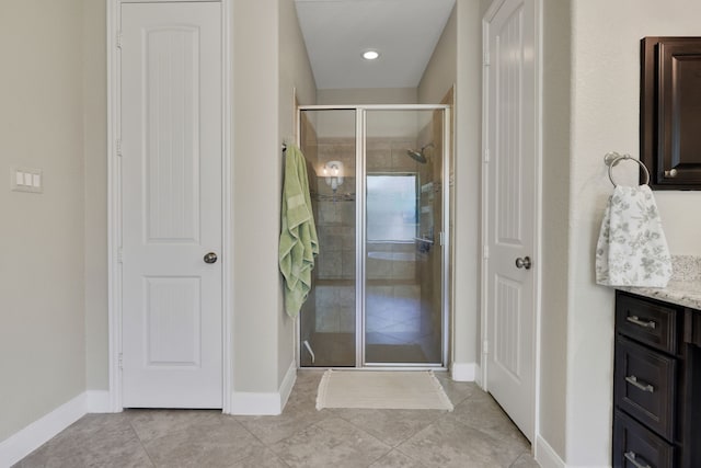 18774 Monetta Dr, New Caney, TX 77357 - full bathroom with a shower stall, vanity, tile patterned floors, and recessed lighting