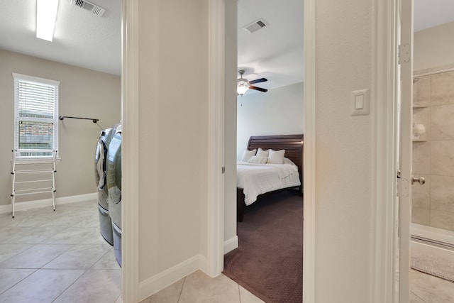 18774 Monetta Dr, New Caney, TX 77357 - laundry room with separate washer and dryer, light tile patterned floors, and ceiling fan