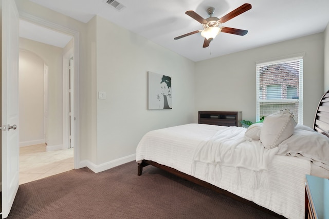 18774 Monetta Dr, New Caney, TX 77357 - bedroom featuring carpet flooring, a ceiling fan, and arched walkways