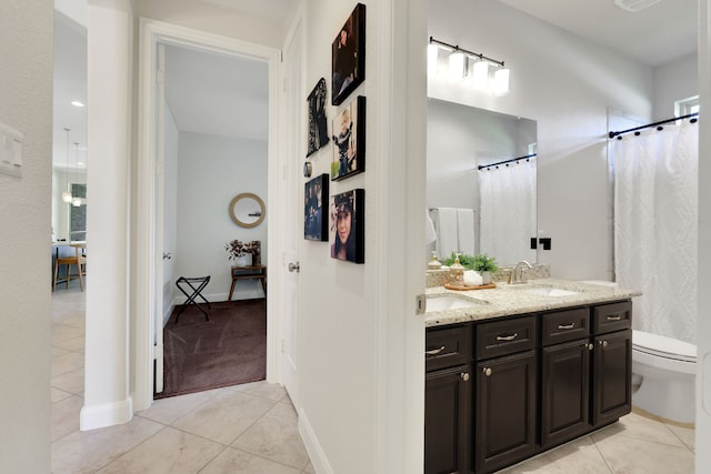 18774 Monetta Dr, New Caney, TX 77357 - full bath with tile patterned flooring, double vanity, and a shower with shower curtain
