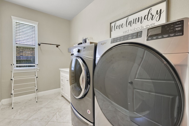 18774 Monetta Dr, New Caney, TX 77357 - washroom with washer and dryer, cabinet space, and light marble finish flooring