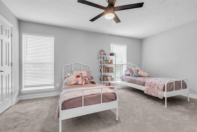 2504 Leroy St, Pearland, TX 77581 - carpeted bedroom featuring a textured ceiling and ceiling fan