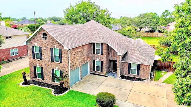 2504 Leroy St, Pearland, TX 77581 - traditional-style house with brick siding, driveway, and an attached garage