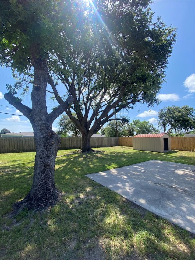 2512 Pine St, Galveston, TX 77551 - fenced backyard with a storage shed and a patio