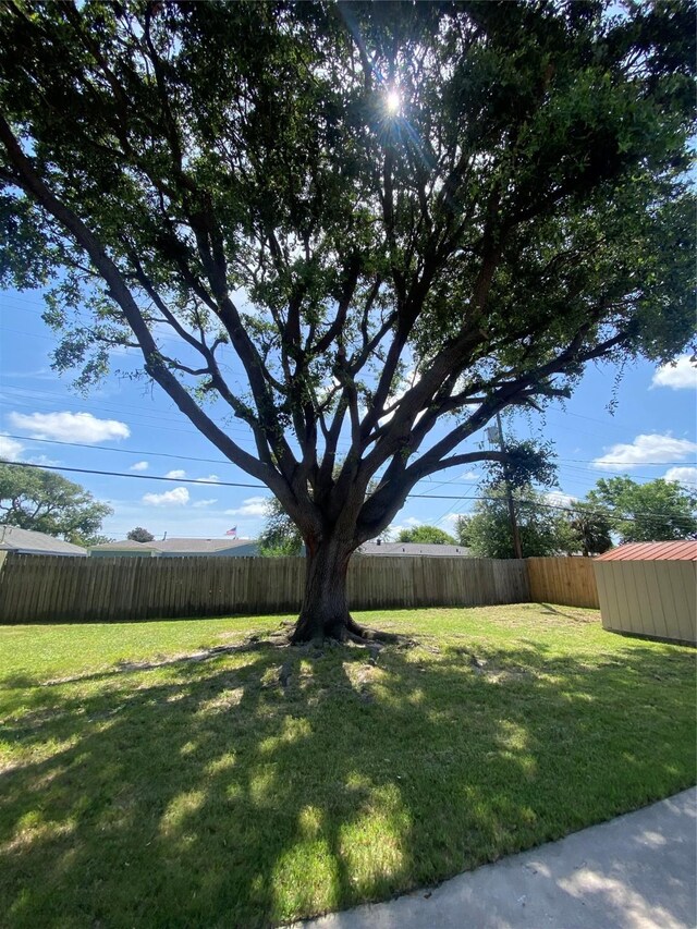 2512 Pine St, Galveston, TX 77551 - fenced backyard featuring a shed