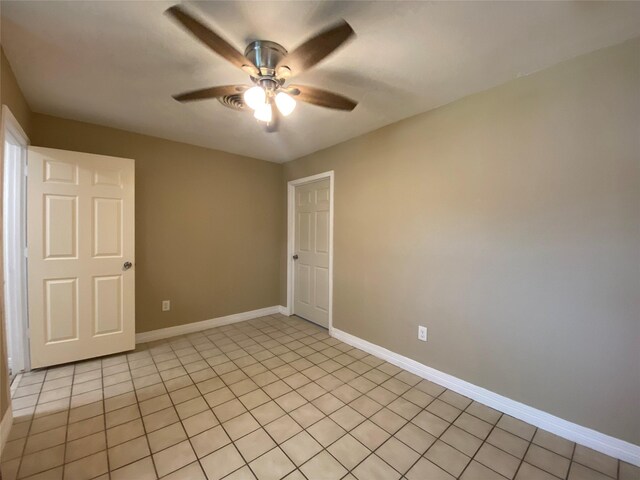 2512 Pine St, Galveston, TX 77551 - empty room featuring ceiling fan and light tile patterned floors