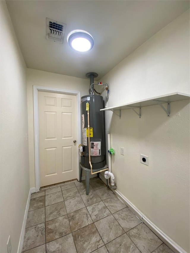 2512 Pine St, Galveston, TX 77551 - washroom featuring gas water heater and electric dryer hookup