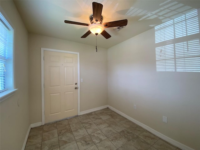 2512 Pine St, Galveston, TX 77551 - unfurnished room featuring a ceiling fan and baseboards