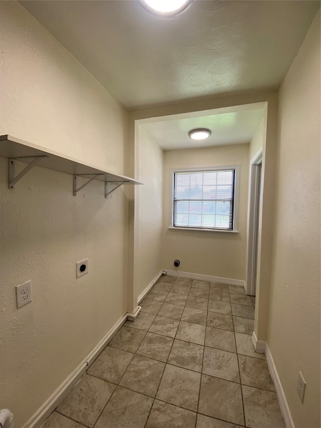 2512 Pine St, Galveston, TX 77551 - laundry room with electric dryer hookup and light tile patterned flooring