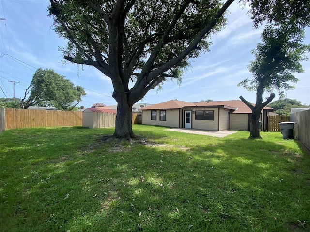 2512 Pine St, Galveston, TX 77551 - fenced backyard featuring a patio