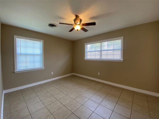 2512 Pine St, Galveston, TX 77551 - spare room with a ceiling fan and light tile patterned floors