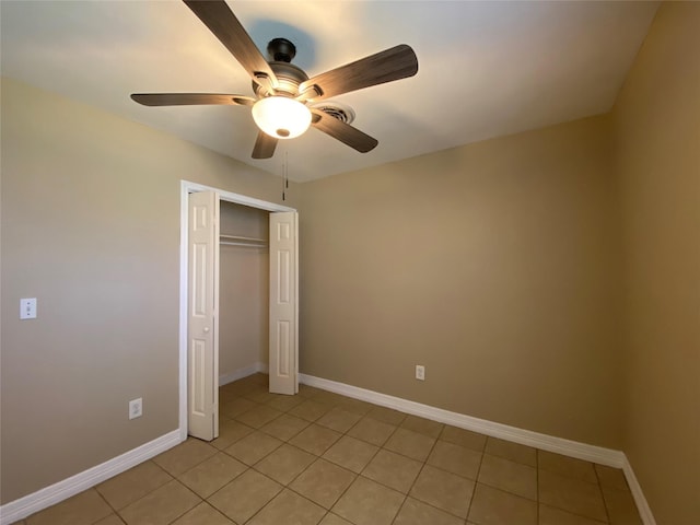 2512 Pine St, Galveston, TX 77551 - unfurnished bedroom with light tile patterned floors, a closet, and ceiling fan