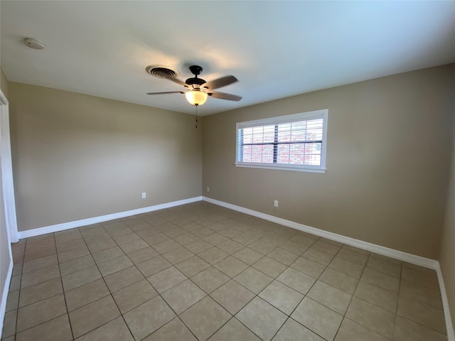 2512 Pine St, Galveston, TX 77551 - empty room featuring ceiling fan, a smoke detector, and light tile patterned floors