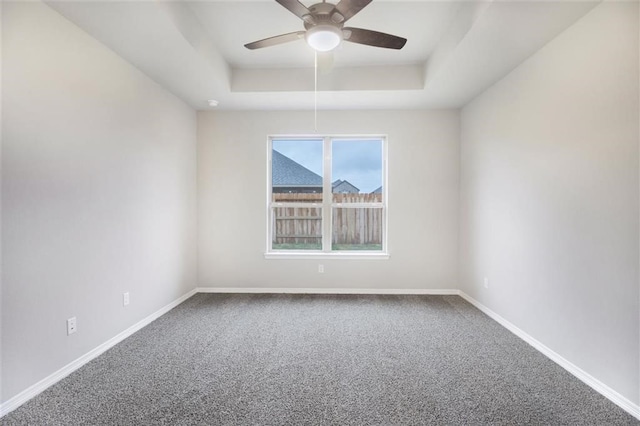 828 Laguna Green Ln, Katy, TX 77493 - carpeted spare room featuring a tray ceiling and a ceiling fan