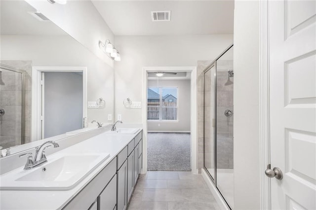 828 Laguna Green Ln, Katy, TX 77493 - bathroom featuring double vanity, a stall shower, and tile patterned floors