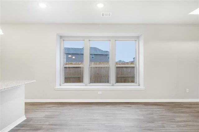 828 Laguna Green Ln, Katy, TX 77493 - spare room with wood finished floors and recessed lighting