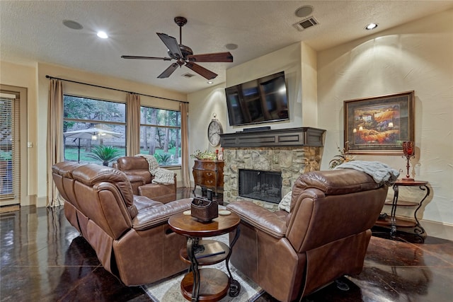 3 Creekwood Dr, Montgomery, TX 77356 - living area with a ceiling fan, a textured ceiling, a fireplace, and recessed lighting