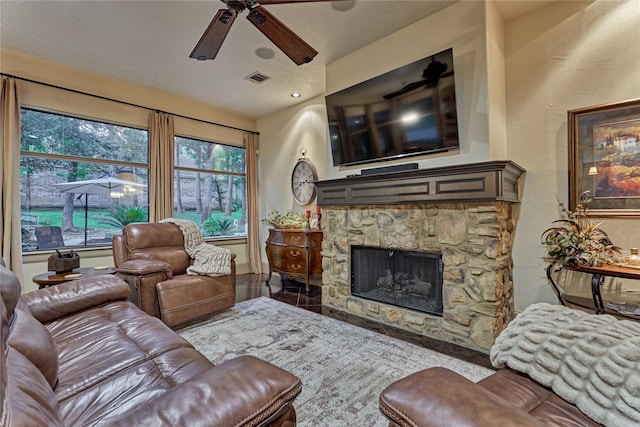 3 Creekwood Dr, Montgomery, TX 77356 - living area featuring ceiling fan and a stone fireplace
