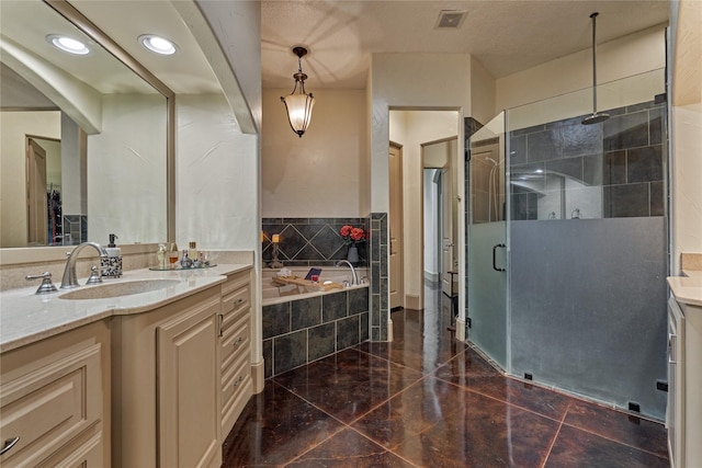 3 Creekwood Dr, Montgomery, TX 77356 - full bath featuring vanity, a stall shower, a garden tub, and recessed lighting