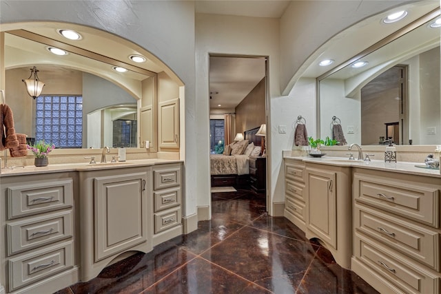 3 Creekwood Dr, Montgomery, TX 77356 - bathroom with marble tiled flooring, two vanities, ensuite bathroom, and recessed lighting