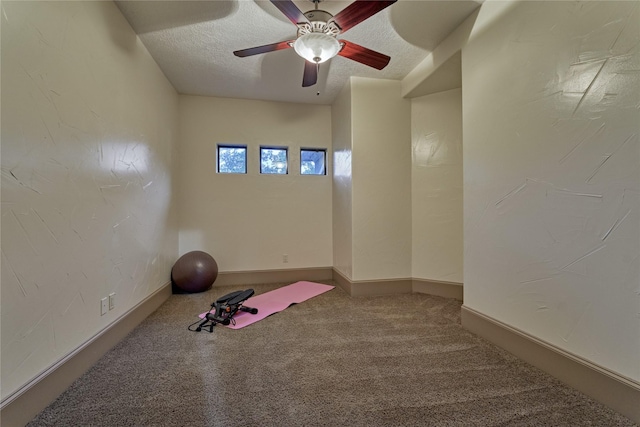 3 Creekwood Dr, Montgomery, TX 77356 - workout area featuring carpet flooring, a textured ceiling, and a ceiling fan