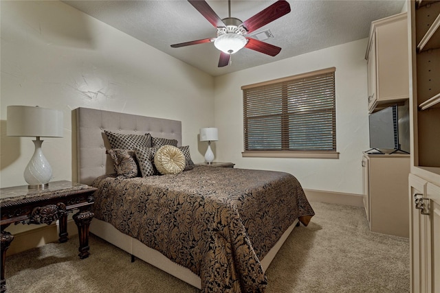 3 Creekwood Dr, Montgomery, TX 77356 - bedroom featuring light carpet, ceiling fan, and a textured ceiling