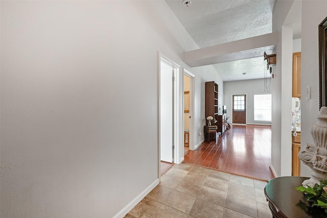 3310 Country Meadows Ct, Pearland, TX 77584 - corridor with a textured ceiling and light tile patterned floors