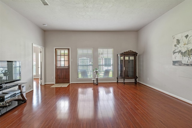3310 Country Meadows Ct, Pearland, TX 77584 - entryway featuring wood finished floors and a textured ceiling