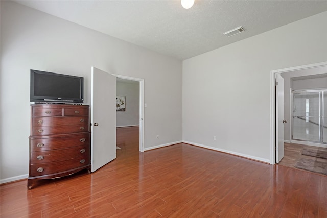 3310 Country Meadows Ct, Pearland, TX 77584 - unfurnished bedroom featuring wood finished floors