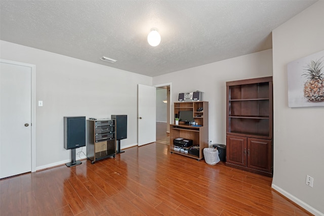 3310 Country Meadows Ct, Pearland, TX 77584 - office with wood finished floors and a textured ceiling