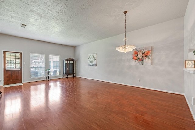 3310 Country Meadows Ct, Pearland, TX 77584 - spare room with wood finished floors and a textured ceiling