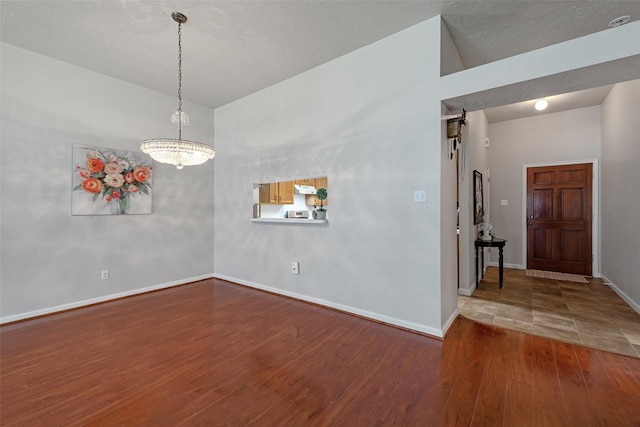 3310 Country Meadows Ct, Pearland, TX 77584 - empty room with wood finished floors and a chandelier