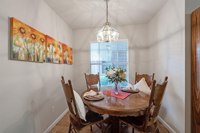 3310 Country Meadows Ct, Pearland, TX 77584 - dining room featuring baseboards and a chandelier