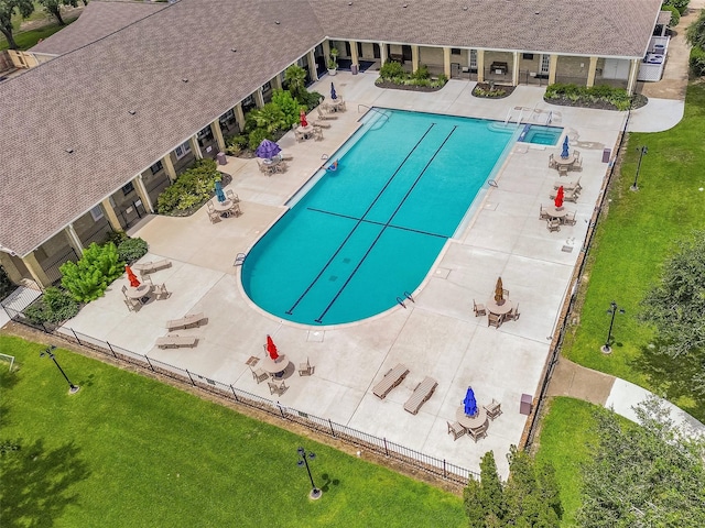 3310 Country Meadows Ct, Pearland, TX 77584 - community pool featuring a patio and a lawn