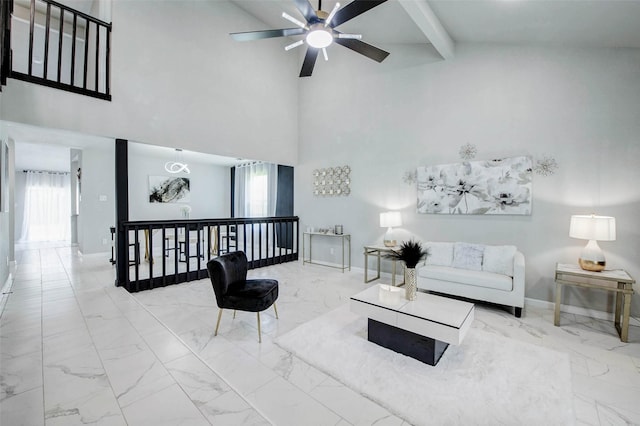 12102 Benmore Dr, Houston, TX 77099 - living area with marble look tiles, a ceiling fan, a towering ceiling, and beamed ceiling