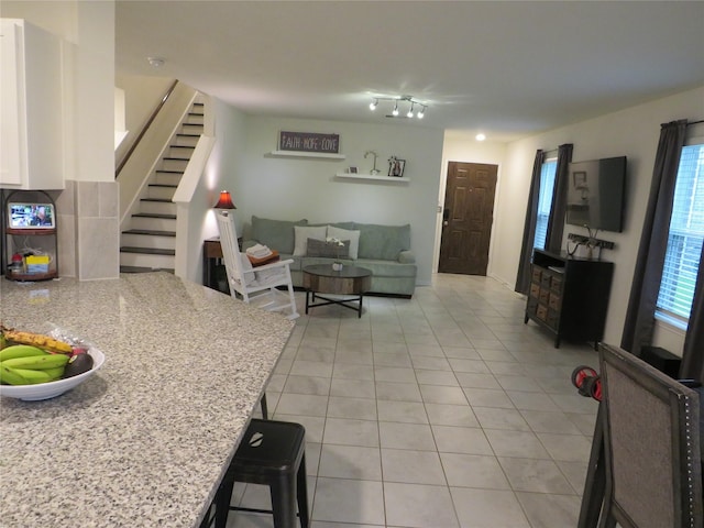 5218 Stone Castle Tower St, Katy, TX 77493 - living room with light tile patterned flooring and stairs