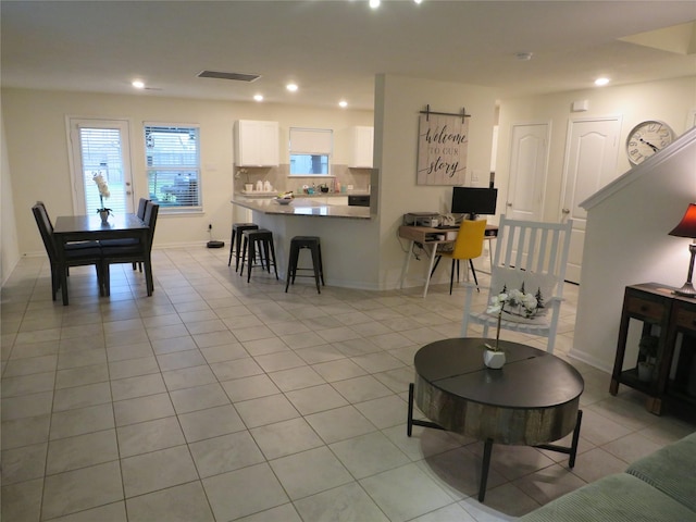 5218 Stone Castle Tower St, Katy, TX 77493 - living area featuring light tile patterned flooring and recessed lighting