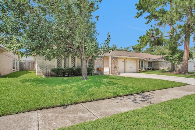 4818 Lost Lake Ln, Spring, TX 77388 - view of front of home featuring brick siding, concrete driveway, and a garage