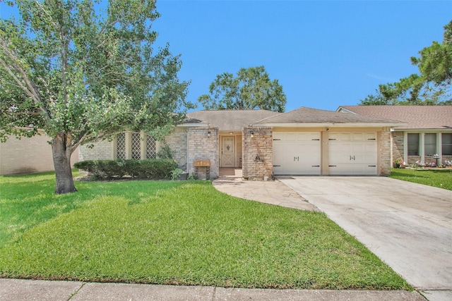 4818 Lost Lake Ln, Spring, TX 77388 - view of front of home with a garage, concrete driveway, a front yard, and brick siding