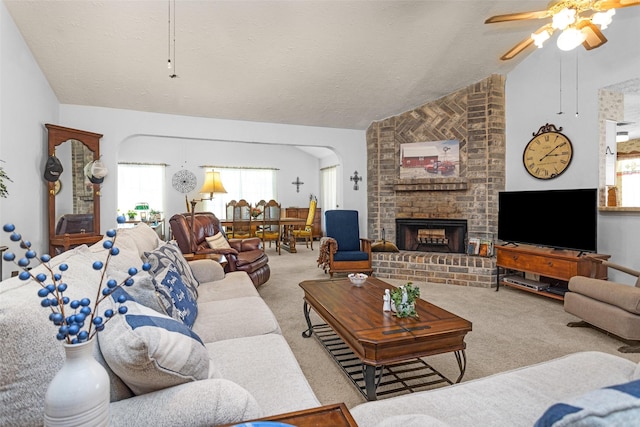 4818 Lost Lake Ln, Spring, TX 77388 - living room with vaulted ceiling, carpet flooring, ceiling fan, arched walkways, and healthy amount of natural light