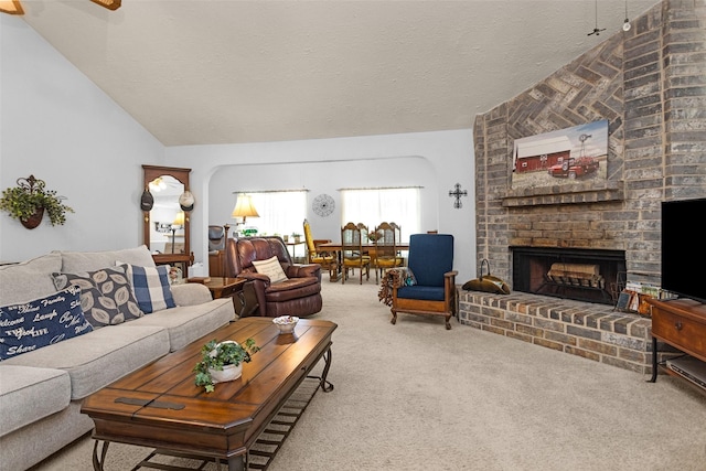 4818 Lost Lake Ln, Spring, TX 77388 - living room with lofted ceiling, carpet flooring, a textured ceiling, and a fireplace